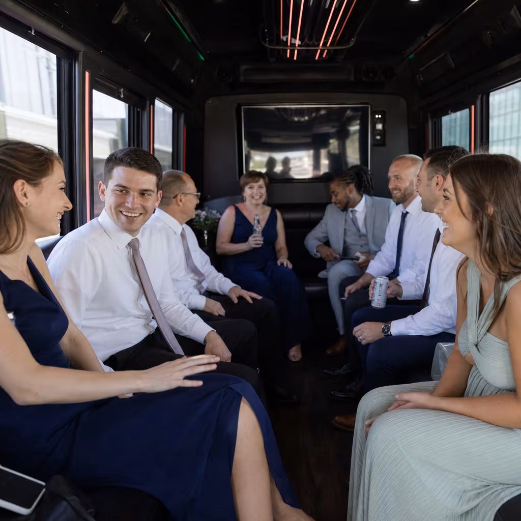 Wedding guests seated inside a San Francisco party bus
