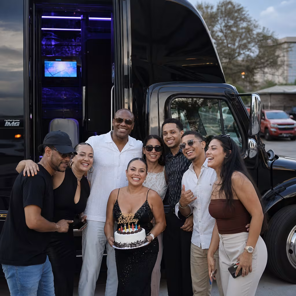 Group boarding a white charter bus for Birthday Transportation transportation in San Francisco