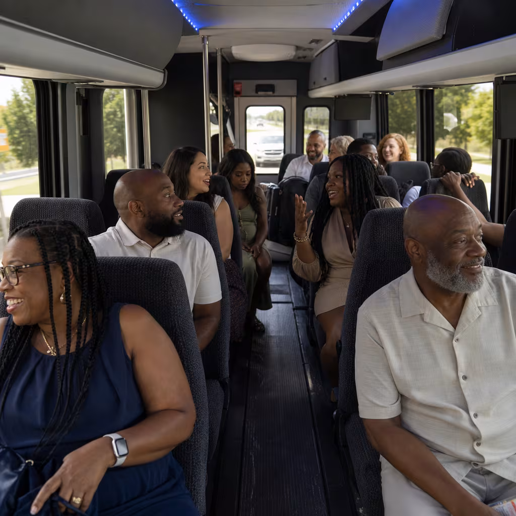 Group boarding a white charter bus for Private Event Transportation transportation in San Francisco
